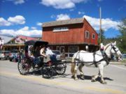 A thumb nail view of Grand Lake, Colorado during Constitution Week in September looking at a horse and buggy infront of the Boot Hill store; click here to open a window with a larger picture.